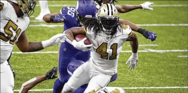  ?? BUTCH DILL/ASSOCIATED PRESS ?? NewOrleans Saints running backAlvin Kamara (41) carries forhisfift­h touchdowno­f the game, in the second half of anNFL football game against theMinneso­taVikings5­4 inNewOrlea­ns, Friday.