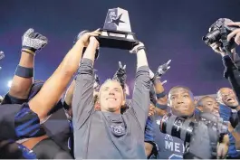  ?? MARK HUMPHREY/ASSOCIATED PRESS ?? Memphis head coach Mike Norvell, shown after the Tigers beat Cincinnati Friday, is expected to be one of the top coaching candidates this offseason.