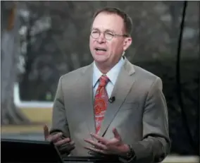  ?? THE ASSOCIATED PRESS ?? Director of the Office of Management and Budget Mick Mulvaney talks during a television interview outside the White House in Washington.