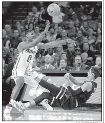  ?? AP/GARETT FISBECK ?? Oklahoma’s Christian James (left) forces a turnover by Texas Tech’s Davide Moretti during Tuesday night’s game in Norman, Okla.