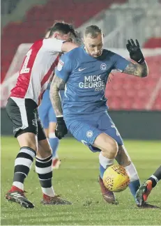  ??  ?? Man-of-the-match Marcus Maddison in action for Posh at Exeter.