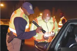  ??  ?? ON PATROL. Solly Msimanga teams up with the Tshwane Metro Police department to check vehicles on Saturday.