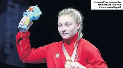  ??  ?? > Lauren Price savours the moment she collected Commonweal­th gold