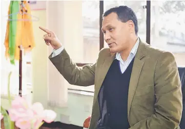  ??  ?? In this photograph taken on Jan 24, Nepal Electricit­y Authority head Kulman Ghising gestures as he speaks in his office during an interview in Kathmandu.