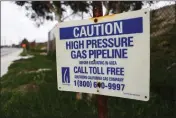  ?? PHOTO: MARIO TAMA/GETTY IMAGES ?? A warning sign for a natural gas pipeline is mounted near the Scattergoo­d Generating Station on Feb. 12, 2019 in El Segundo, Calif.