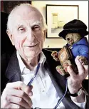  ??  ?? In this June 12, 2015 file photo, Michael Bond poses with a soft toy version of Paddington bear. (AP)