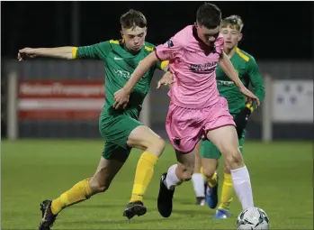  ??  ?? Harry Curtis tries to evade the close attention of Carlow/Kilkenny’s Scott Roycroft.