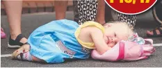  ??  ?? Ellie Yates, 3, of Highton, has a quick nap before the parade.