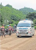  ?? Picture: Getty Images. ?? Daring rescue: An ambulance leaves the scene after more boys were brought out of the cave.