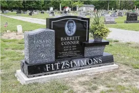  ?? BILL LACKEY PHOTOS / STAFF ?? Barrett Fitzsimmon­s’ headstone Wednesday at the Myers Cemetery near North Hampton.