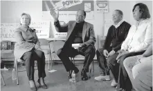  ?? | CAROLYN KASTER/AP ?? On March 14, Hillary Clinton, joined by Jethro Head (second from left) of the The Bakery, Confection­ery, Tobacco Workers and Grain Millers Internatio­nal Union, visited union members affected by Nabisco’s Chicago layoffs.