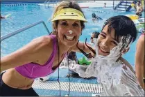  ?? PHOTOS CONTRIBUTE­D BY SHARI STAFFORD ?? Longtime fitness and youth dance instructor Shari Stafford with Jorge Olivencia at a Mandel JCC family event in 2016. Stafford is starting a Special Olympics cheerleadi­ng squad in Palm Beach County.