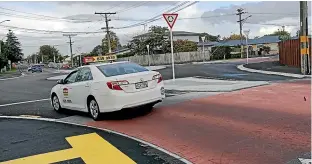  ?? SUPPLIED ?? An example of one of Hamilton’s pink paving ‘‘courtesy crossings’’.