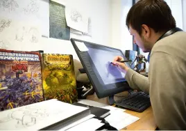  ??  ?? Concept artist Tom Harrison at work. He has “eternal dibs on anything relating to dragons”, according to Dave.