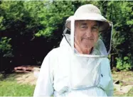  ?? JOURNAL SENTINEL FILES ?? East Troy beekeeper Dan O'Leary has been beekeeping for over 20 years; he sells his honey wholesale locally and at farmers markets.