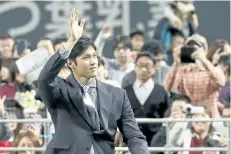  ?? MASANORI TAKEI/AP ?? Shohei Ohtani waves to fans during a news conference Monday in Sapporo, Japan. Los Angeles Angels-bound Ohtani bid farewell to fans of his former Japanese club Nippon Ham Fighters as he sets off to join his new team.