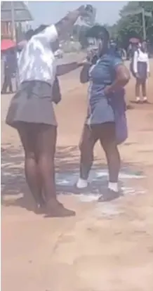  ??  ?? SUSPECTED bully Onthatile Magagula, 18, is seen in a video pouring a liquid over the head of Keleabetsw­e Maboa, also 18.