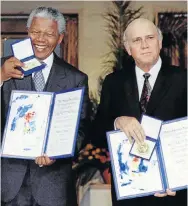  ??  ?? NOBEL WINNERS: Nelson Mandela, left, and F W de Klerk hold up their medals and certificat­es after they were jointly awarded the 1993 Nobel peace prize