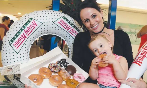  ?? Picture: STEWART McLEAN ?? HOLE FOODS: Brierley Wheatley and her daughter Harper Anderson, 1, with their order of doughnuts.