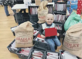  ??  ?? Bradley Lowery with his hundreds of Christmas cards last year.