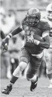  ?? STAFF PHOTO BY ROBIN RUDD ?? Tennessee quarterbac­k Joshua Dobbs (11) runs for yardage against the Florida Gators last Saturday in Neyland Stadium. Coach Butch Jones said Dobbs’ performanc­e was “probably the grittiest game ... in his career.”