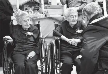  ?? TINA COMEAU • TRI-COUNTY VANGUARD ?? Twin sisters Delina Comeau and Delphine LeBlanc celebrated their 100th birthdays at an open house held at the Villa Acadienne in Meteghan, Digby County, on Thursday.