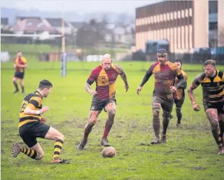  ??  ?? Action man Former Marine Sandy Dove (centre) wants more vets to join him