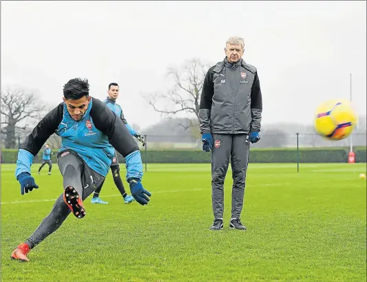  ?? Picture: GETTY IMAGES ?? HOT PROPERTY: Arsenal manager Arsene Wenger, right, with Alexis Sanchez during a training session