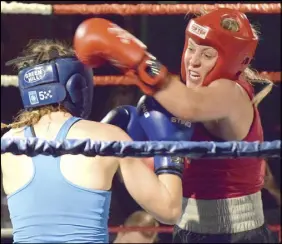  ?? TRURO DAILY NEWS PHOTO ?? Destiney Wysote, in red, of Hubtown Boxing Club looks to land a punch during her match with Sarah Moldonado of Seaside Boxing Club Saturday night during Amateur Fight Night. Moldonado won the bout by unanimous decision.