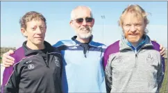  ?? ?? Willie O’Donoghue (left) and Damien Holian (right) of Mooreabbey Milers pictured with Eugene O’Keeffe of Carrick on Suir at the novice B roads championsh­ips last Sunday.