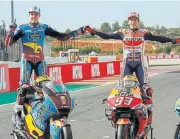  ??  ?? Marquez brothers Alex (left) and Marc celebrate winning this year’s respective Moto2 and MotoGP championsh­ips.