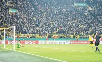  ?? - AFP photo ?? Dortmund’s German forward Marco Reus scores a penalty during the German Cup (DFB Pokal) second round football match BVB Borussia Dortmund v Union Berlin in Dortmund, western Germany.