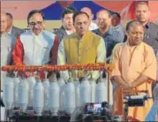  ?? HT PHOTO ?? Gujarat chief minister Vijay Rupani with UP CM Yogi Adityanath inaugurati­ng a solar ‘charkha’ at the Ekta Samvad function in Lucknow on Monday.