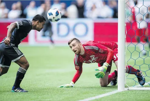  ?? — PHOTOS: CP FILES ?? Cristian Techera of the Whitecaps, left, scores his second of the match against the New England Revolution during MLS action in Vancouver back on May 26. Techera scored all three Vancouver goals in a 3-3 draw.