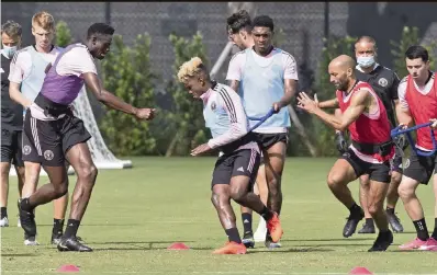  ?? AL DIAZ adiaz@miamiheral­d.com ?? Inter Miami is preparing to play its first preseason game on Saturday: From left, Ethan Hardin, Aimé Mabika, Brian Rosales, Christian Makoun, Federico Higuaín and Lewis Morgan work Tuesday at the team’s training center in Fort Lauderdale.