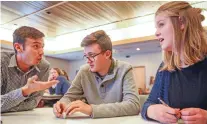  ??  ?? From left:, Theodore Goujon, Justin Reynolds and Sadie Webb, a team from Santa Fe High School, discuss a question Thursday during the final round of the Academic World Quest event. Santa Fe High finished second in the competitio­n.