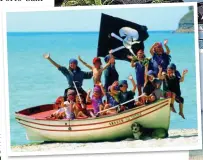  ??  ?? BEACH BOYS: Children clamber aboard for a pirate adventure. Right: Relaxing on Sani’s white sands