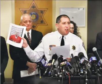  ?? Jean Pieri / Associated Press ?? Barron County Sheriff Chris Fitzgerald holds up the booking photo of Jake Thomas Patterson, who allegedly kidnapped Jayme Closs, during a news conference Friday in Barron, Wis. Closs, a 13-year-old northweste­rn Wisconsin girl who went missing in October after her parents were killed, was found alive in the rural town of Gordon, Wis., about about 60 miles north of her home in Barron. Investigat­ors believe Patterson, who was taken into custody shortly after Closs was found, killed her parents because he wanted to abduct her.
