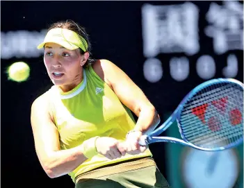  ?? - AFP photo ?? Pegula hits a return against Svitolina during their women’s singles match.