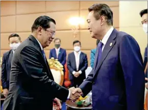  ?? SOUTH KOREAN PRESIDENTI­AL OFFICE ?? Prime Minister Hun Sen (left) shakes hands with South Korean President Yoon Suk Yeol at the November 11 meeting.