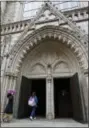  ??  ?? In this photo, Daniela Carvajal, 8, arrives from school followed by a classmate, as they enter the arched doorway of the Holyrood Episcopal Church in the Bronx borough of New York. When immigratio­n authoritie­s ordered Carvajal’s mother, Amanda Morales,...