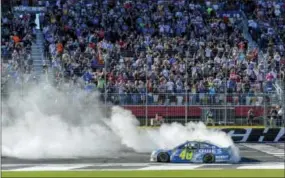  ?? MIKE MCCARN — THE ASSOCIATED PRESS ?? Jimmie Johnson (48) celebrates after winning the NASCAR Sprint Cup Series race, Sunday, at Charlotte Motor Speedway in Concord, N.C.