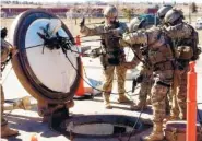  ?? ASSOCIATED PRESS FILE PHOTO ?? In February 2016, members of the 790th Missile Security Forces Squadron demonstrat­e their training for recapturin­g a Minuteman missile silo after being taken over by an intruder/attacker, just days before the Air Force announced a drug investigat­ion at...