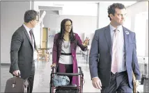  ?? DEBORAH CANNON / AMERICAN-STATESMAN ?? State Rep. Dawnna Dukes, D-Austin, waves at someone as she walks with her attorneys into court on Wednesday. Dukes faces 13 felony charges.