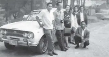  ??  ?? THE AUTHOR’S family together with drivers by the Isuzu Bellett in 1969.