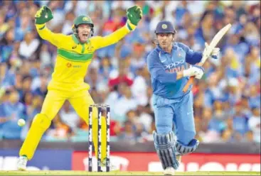  ?? AFP ?? ▪ Mahendra Singh Dhoni, who took 36 balls to get to six runs, could not find the next gear unlike Rohit Sharma and take India past the finishing line on Saturday after both were off to slow starts.