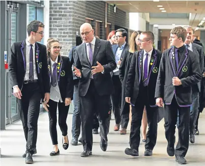  ?? Picture: Mhairi Edwards. ?? Levenmouth Academy pupils, from left, Ross Kinnimont, Amy Newell, Stuart McKay and Aaron Notnan with Deputy First Minister John Swinney.