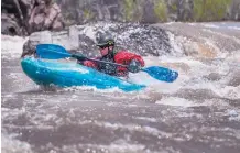  ??  ?? The Big Rock rapid on the Rio Grande on the “racecourse” south of Pilar is conquered by kayaker Willam Van Herpe on Tuesday.