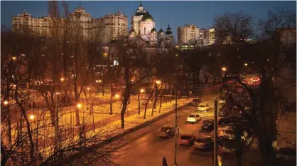  ??  ?? VORONEZH, Russia: In this photo taken Wednesday, Nov 23, 2016, cars go through a street.—AP