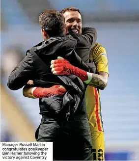  ?? ?? Manager Russell Martin congratula­tes goalkeeper Ben Hamer following the victory against Coventry